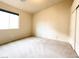 Bedroom with neutral paint, carpet, and a window at 8161 Cane Creek Mill Ct, Las Vegas, NV 89131