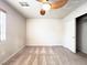 Bright bedroom featuring carpeted floors, a ceiling fan, and a sliding door closet at 8161 Cane Creek Mill Ct, Las Vegas, NV 89131