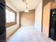 Cozy dining nook with window seat, tile floor, and adjacent kitchen with black appliances at 8161 Cane Creek Mill Ct, Las Vegas, NV 89131