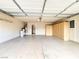 Spacious garage featuring epoxy flooring, built-in storage, and ample room for parking at 8161 Cane Creek Mill Ct, Las Vegas, NV 89131