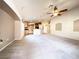 Open-concept living room with lots of natural light and views of the kitchen at 8161 Cane Creek Mill Ct, Las Vegas, NV 89131