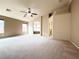 Large main bedroom with vaulted ceilings, carpeted flooring, and access to the bathroom and walk-in closet at 8161 Cane Creek Mill Ct, Las Vegas, NV 89131
