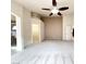 Spacious main bedroom featuring carpet, a ceiling fan, access to walk-in closet, and neutral paint at 8161 Cane Creek Mill Ct, Las Vegas, NV 89131