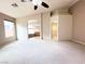 Carpeted main bedroom featuring an ensuite bathroom and a walk-in closet at 8161 Cane Creek Mill Ct, Las Vegas, NV 89131