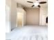 Main bedroom boasting high ceilings, neutral paint, carpet flooring, a ceiling fan, and a walk-in closet at 8161 Cane Creek Mill Ct, Las Vegas, NV 89131
