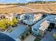 Aerial view of a modern home showcasing stone accents, landscaping and a paved driveway at 82 Glade Hollow Dr, Las Vegas, NV 89135