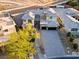 Luxury home with a paved driveway and landscaping visible in this elevated exterior shot at 82 Glade Hollow Dr, Las Vegas, NV 89135