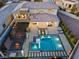 Aerial view of a modern home with a luxurious pool, spa, outdoor kitchen, and covered patios at 82 Glade Hollow Dr, Las Vegas, NV 89135