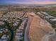 Community aerial view showcasing neighborhood layout and home proximity to city skyline at 82 Glade Hollow Dr, Las Vegas, NV 89135