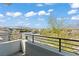 Balcony overlooking street with scenic views, blue skies, and white clouds at 82 Glade Hollow Dr, Las Vegas, NV 89135