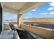 Outdoor balcony area showcasing black patio chairs, railings, and desert views on a sunny day at 82 Glade Hollow Dr, Las Vegas, NV 89135