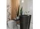 Modern bathroom featuring a unique black stone sink, wood paneling, and marble accents at 82 Glade Hollow Dr, Las Vegas, NV 89135