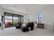 Serene bedroom with a private balcony showcasing scenic desert views, perfect for relaxing evenings at 82 Glade Hollow Dr, Las Vegas, NV 89135