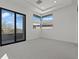 Bright, spacious bedroom featuring recessed lighting, neutral decor, and a sliding glass door to private balcony at 82 Glade Hollow Dr, Las Vegas, NV 89135