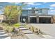 Charming home featuring modern design, stone accents and a manicured front yard at 82 Glade Hollow Dr, Las Vegas, NV 89135