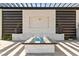 Modern outdoor fire pit area with sleek design, stone accents, and ambient lighting at 82 Glade Hollow Dr, Las Vegas, NV 89135