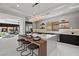 Modern kitchen featuring an island with bar seating, sleek countertops, and stainless steel appliances at 82 Glade Hollow Dr, Las Vegas, NV 89135