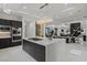 Expansive kitchen with a large island, open to the dining and living areas, perfect for entertaining at 82 Glade Hollow Dr, Las Vegas, NV 89135