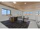 Bright office space featuring a modern desk, a cozy seating area, and a sleek wooden ceiling at 82 Glade Hollow Dr, Las Vegas, NV 89135