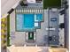 Aerial view of a modern backyard oasis with a sparkling pool, spa, and outdoor living spaces at 82 Glade Hollow Dr, Las Vegas, NV 89135