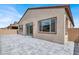 Backyard view featuring a covered patio with access to the house and a gray paver hardscape at 851 Klamath Springs St, Henderson, NV 89011