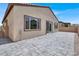 Backyard features a modern patio, stucco wall, with convenient access to the house at 851 Klamath Springs St, Henderson, NV 89011