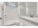 This bathroom features a shower and tub combination, a modern vanity, and a neutral color palette at 851 Klamath Springs St, Henderson, NV 89011