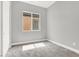 Neutral bedroom with grey walls, plush carpet, window for natural light, and modern minimalist trim at 851 Klamath Springs St, Henderson, NV 89011