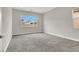 Spacious bedroom featuring neutral walls, carpet flooring, and two windows for ample lighting at 851 Klamath Springs St, Henderson, NV 89011