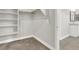 White shelving in walk in closet leading to bathroom area at 851 Klamath Springs St, Henderson, NV 89011