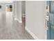 The entryway has a blue door, gray tile flooring, and a view of the hallway and bathroom at 851 Klamath Springs St, Henderson, NV 89011