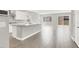 Open-concept kitchen with an island, stainless steel appliances, and gray tile flooring at 851 Klamath Springs St, Henderson, NV 89011