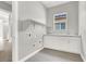 Bright laundry room features storage cabinets, modern countertops, a sink, and convenient shelving at 851 Klamath Springs St, Henderson, NV 89011