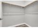 A walk-in closet features built-in shelving for optimal organization and storage at 851 Klamath Springs St, Henderson, NV 89011