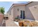 Private backyard featuring a small patio, planting containers, and easy-care gravel landscaping at 8524 Little Fox St, Las Vegas, NV 89123
