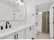 Bathroom featuring double sinks, white cabinets, and new fixtures at 8524 Little Fox St, Las Vegas, NV 89123