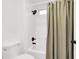 Bathroom with a walk-in shower, shower curtain, and tiled walls at 8524 Little Fox St, Las Vegas, NV 89123