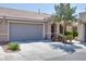 Lovely single-story home featuring a tile roof, desert landscaping, and a convenient two-car garage at 8524 Little Fox St, Las Vegas, NV 89123