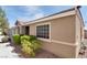 Charming home featuring desert landscaping, a tile roof, and a side window for added natural light at 8524 Little Fox St, Las Vegas, NV 89123