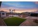 Backyard boasts a sparkling pool, lush lawn, and ample space for entertaining at 8610 Mohawk St, Las Vegas, NV 89139