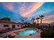 Private backyard oasis featuring a large swimming pool and a covered patio area for relaxation at 8610 Mohawk St, Las Vegas, NV 89139