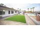 Expansive backyard with a lush lawn, a refreshing pool, and inviting outdoor seating at 8610 Mohawk St, Las Vegas, NV 89139