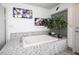 Bright bathroom features a tiled bathtub with natural light at 8610 Mohawk St, Las Vegas, NV 89139