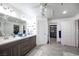 Bright bathroom features double sinks, walk-in closet and seashell decor at 8610 Mohawk St, Las Vegas, NV 89139