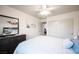 Bright bedroom featuring closet, dresser, mirror and modern ceiling fan at 8610 Mohawk St, Las Vegas, NV 89139