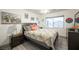 Comfortable bedroom with neutral tones, ceiling fan, and exterior views at 8610 Mohawk St, Las Vegas, NV 89139