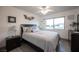 Comfortable bedroom with a ceiling fan and large window for natural light at 8610 Mohawk St, Las Vegas, NV 89139
