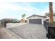 A paved driveway leads up to a two car garage at 8610 Mohawk St, Las Vegas, NV 89139