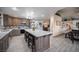 Stylish kitchen features an island with seating and views into the living area at 8610 Mohawk St, Las Vegas, NV 89139
