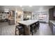 Bright kitchen showcases a center island with seating, seamlessly connecting to living spaces at 8610 Mohawk St, Las Vegas, NV 89139